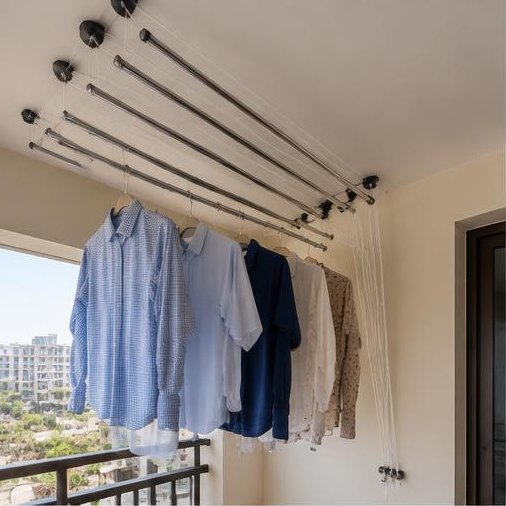 Ceiling-mounted metal clothes drying rods and pulley ropes on a balcony