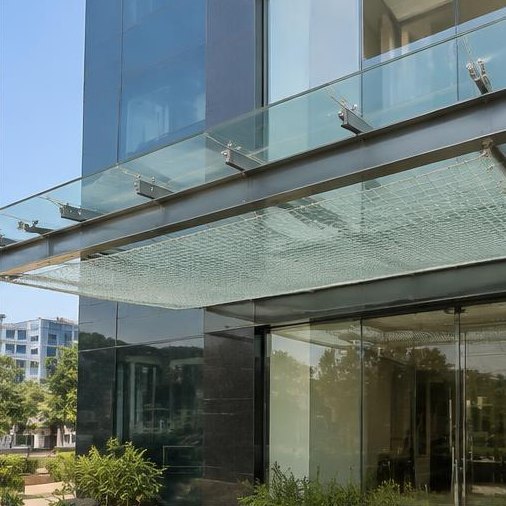 Safety catch net fitted below a commercial glass canopy